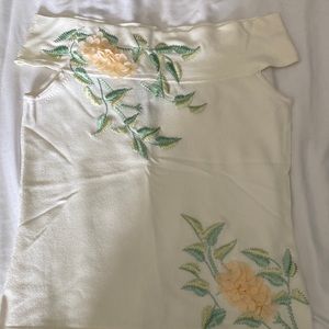 Off shoulder lightweight sweater with beautiful embroidery. Off white color